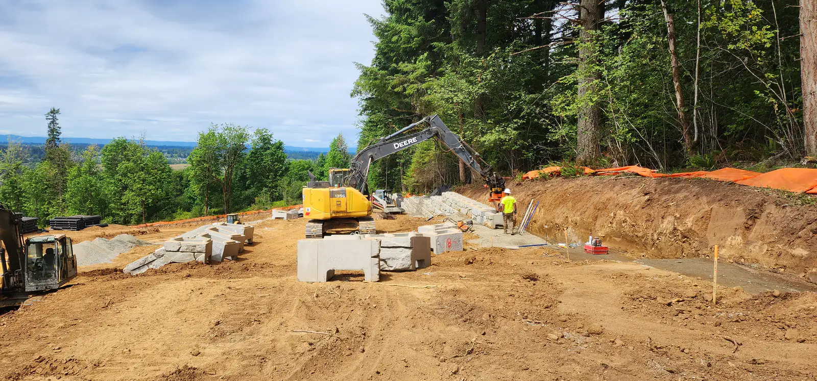 LPG crew setting retaining wall units with an excavator